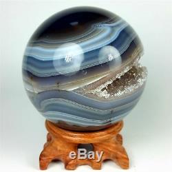 3.45 Polished agate sphere with crystal cluster center withwood Stand Brazil A227