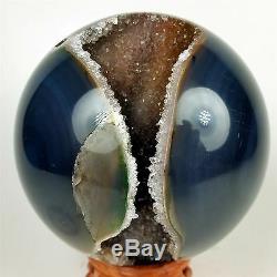 3.83 Polished agate sphere with crystal cluster center withwood Stand Brazil A284