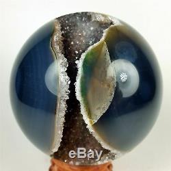 3.83 Polished agate sphere with crystal cluster center withwood Stand Brazil A284